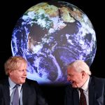 Boris Johnson talks to Sir David Attenborough in front of a globe