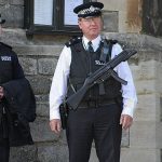 Do we feel safer in places where cops have guns?